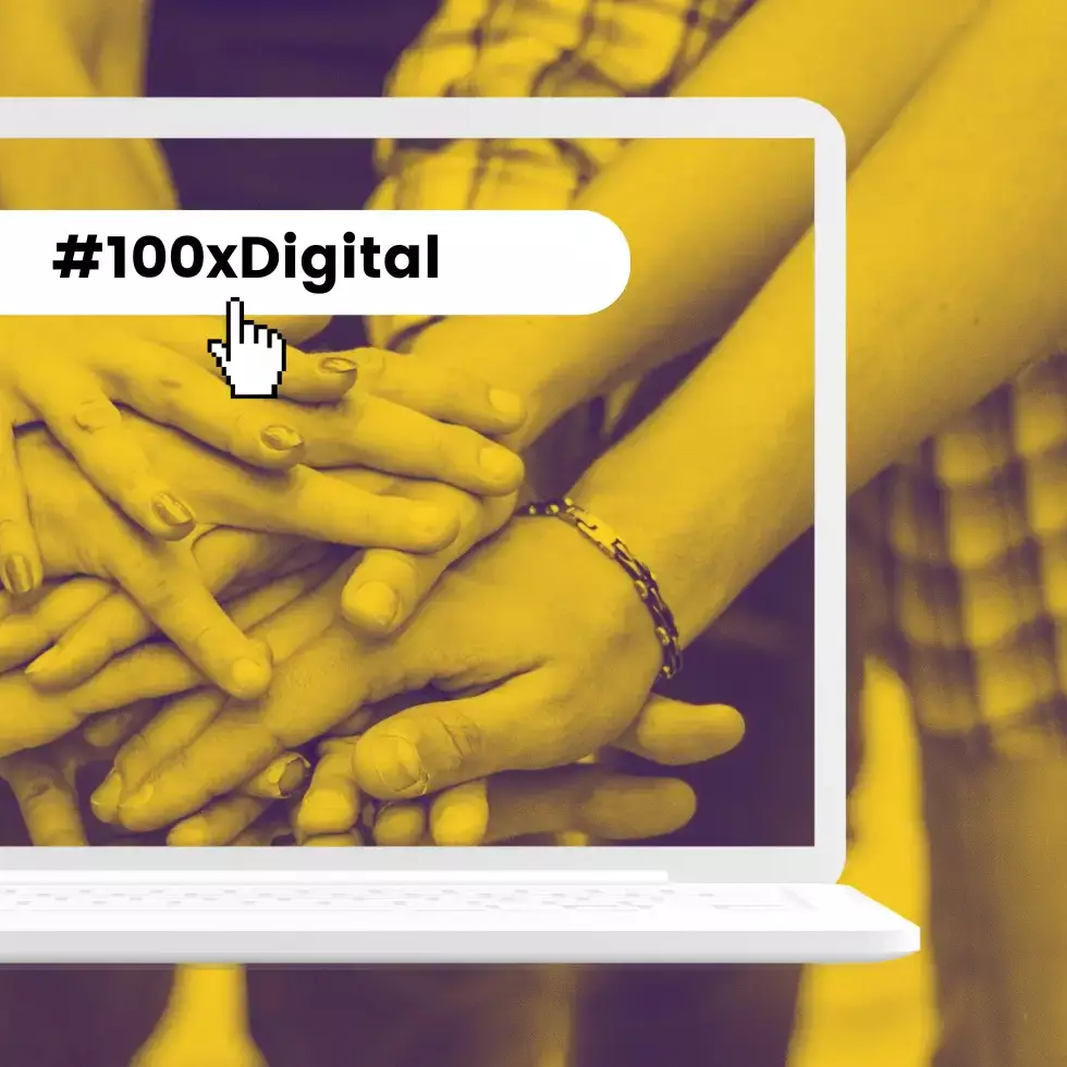 Übereinandergelegte Hände in einem Laptop mit dem Schriftzug „#100xDigital“.